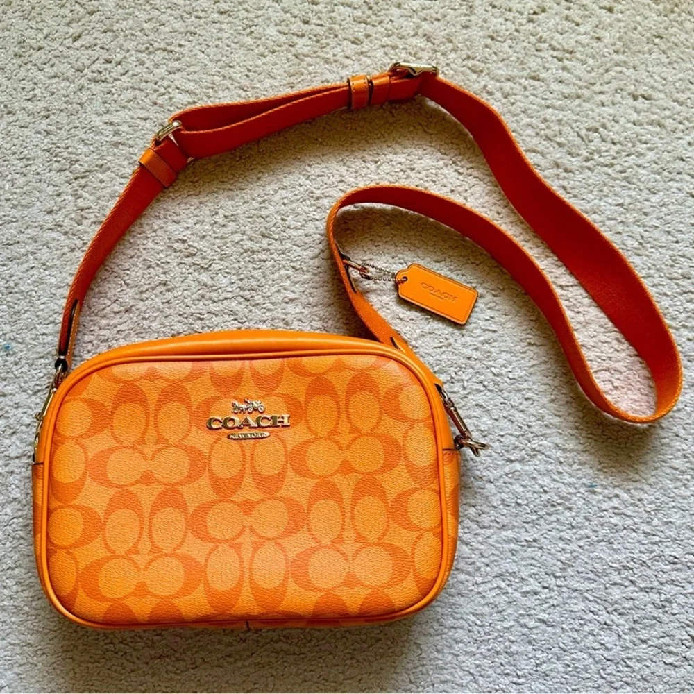 Coach Orange Crossbody Bag with Adjustable Strap and Monogram Pattern - Picture 1 of 7
